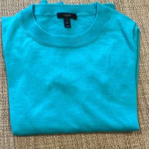 Woman’s crew neck sweater.